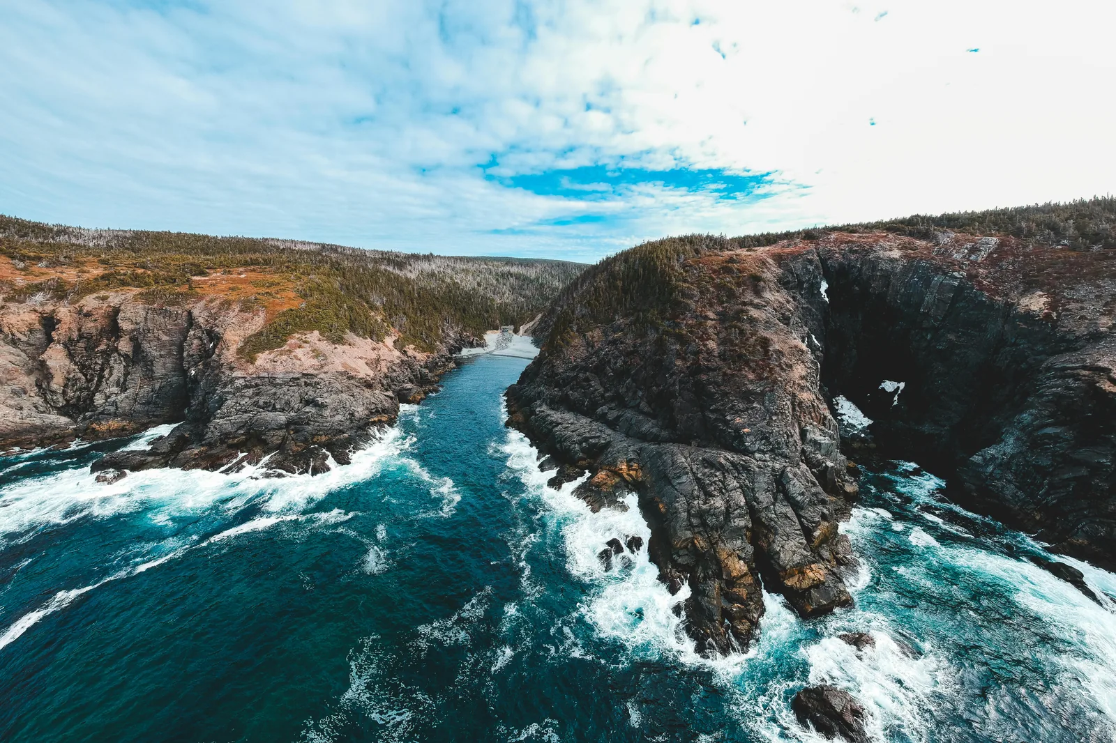 Aerial photorealistic view of Cala des Moro-style cove at golden hour.