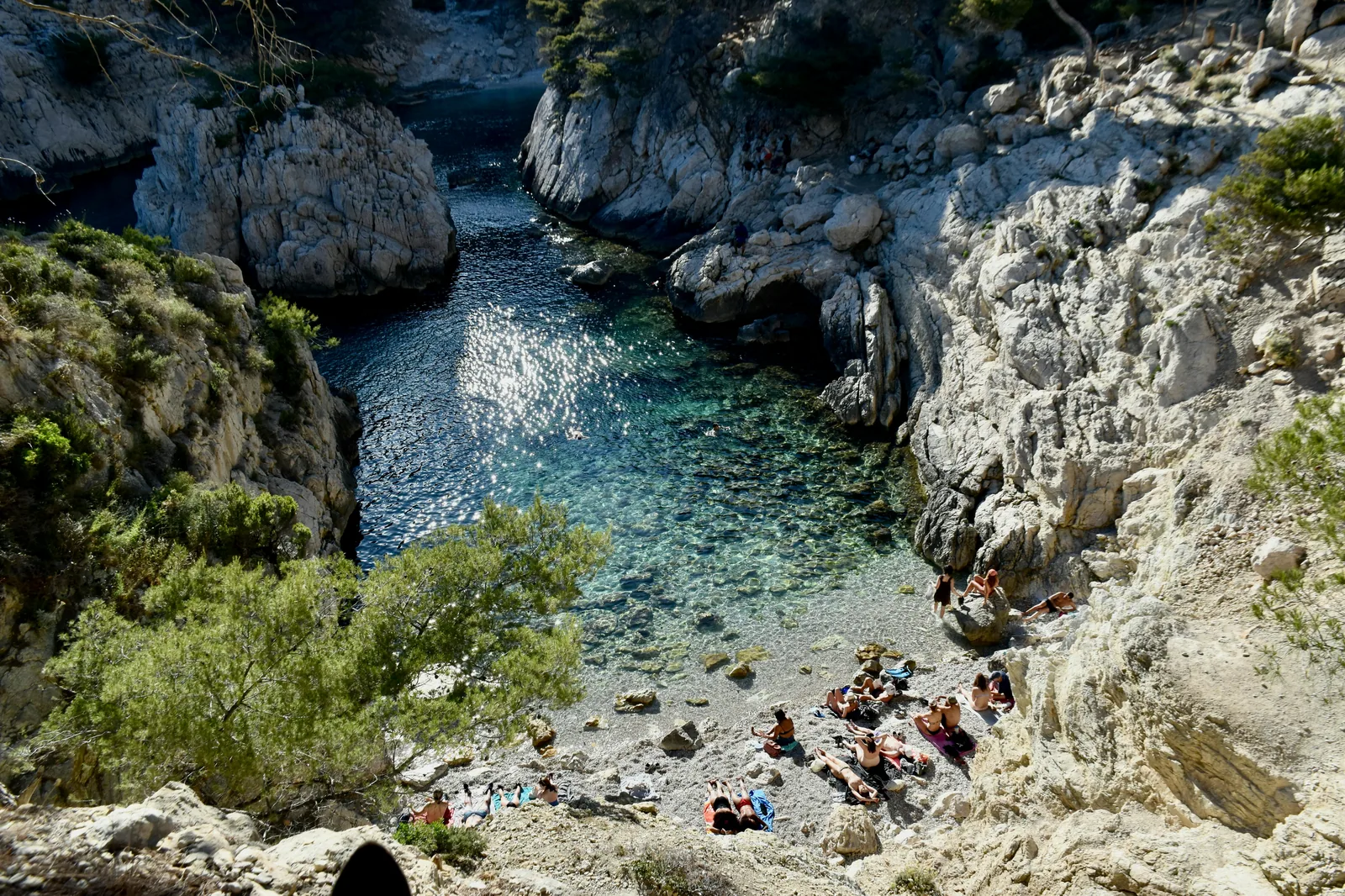 Family enjoying a private yacht day in a secluded Mallorcan cove.
