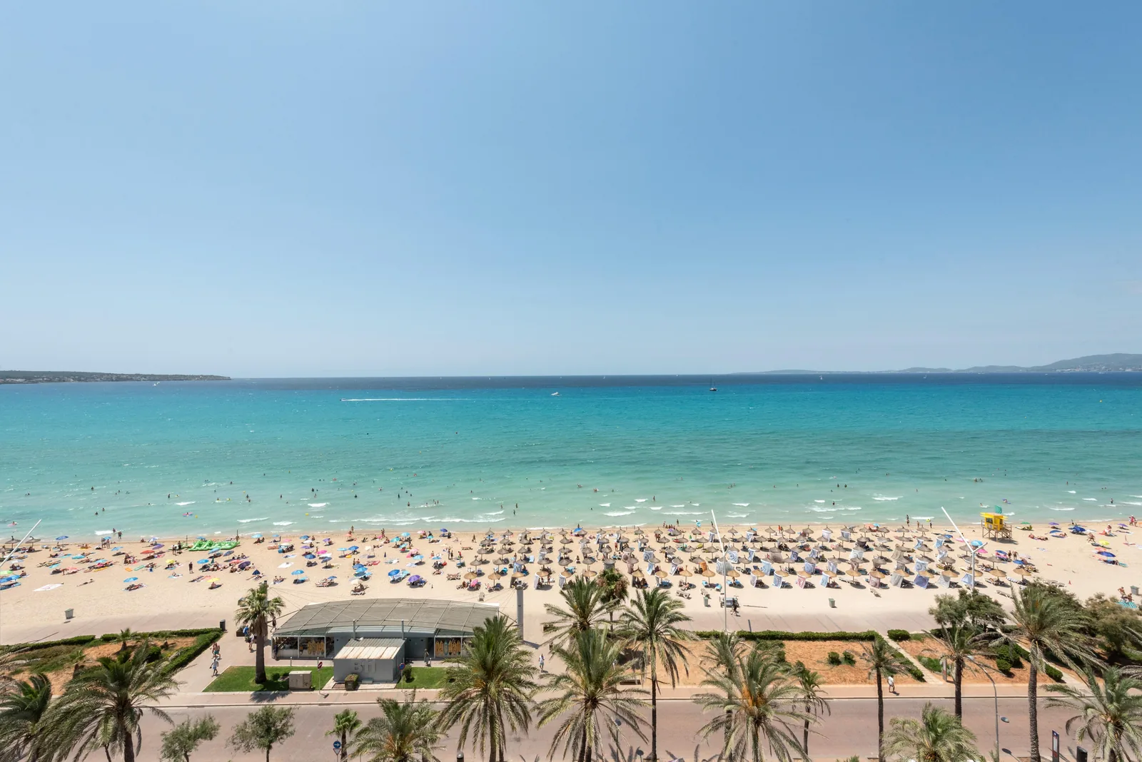 Luxury beach club with dedicated kids' area and family amenities.